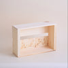 Square wooden light fixture on a white wall